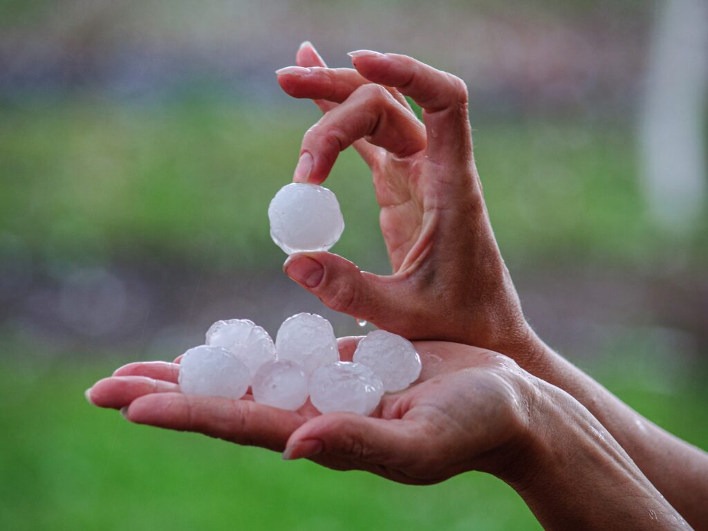 Woman holding hail in her hands