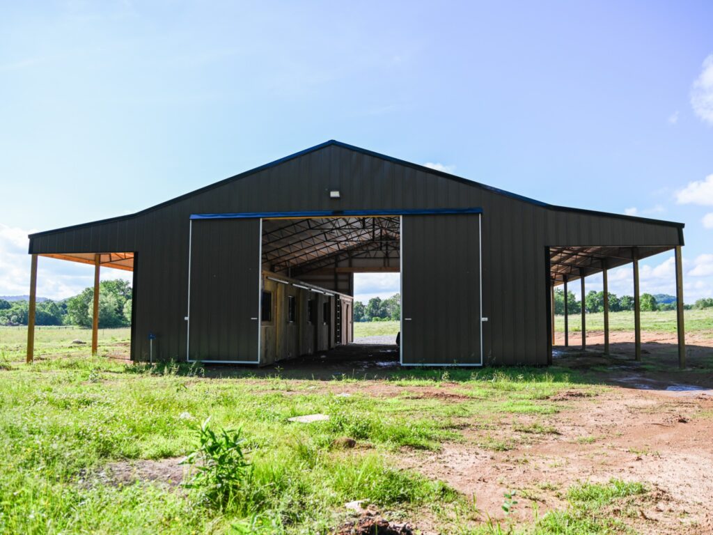 Picture of a pole barn used for horses.